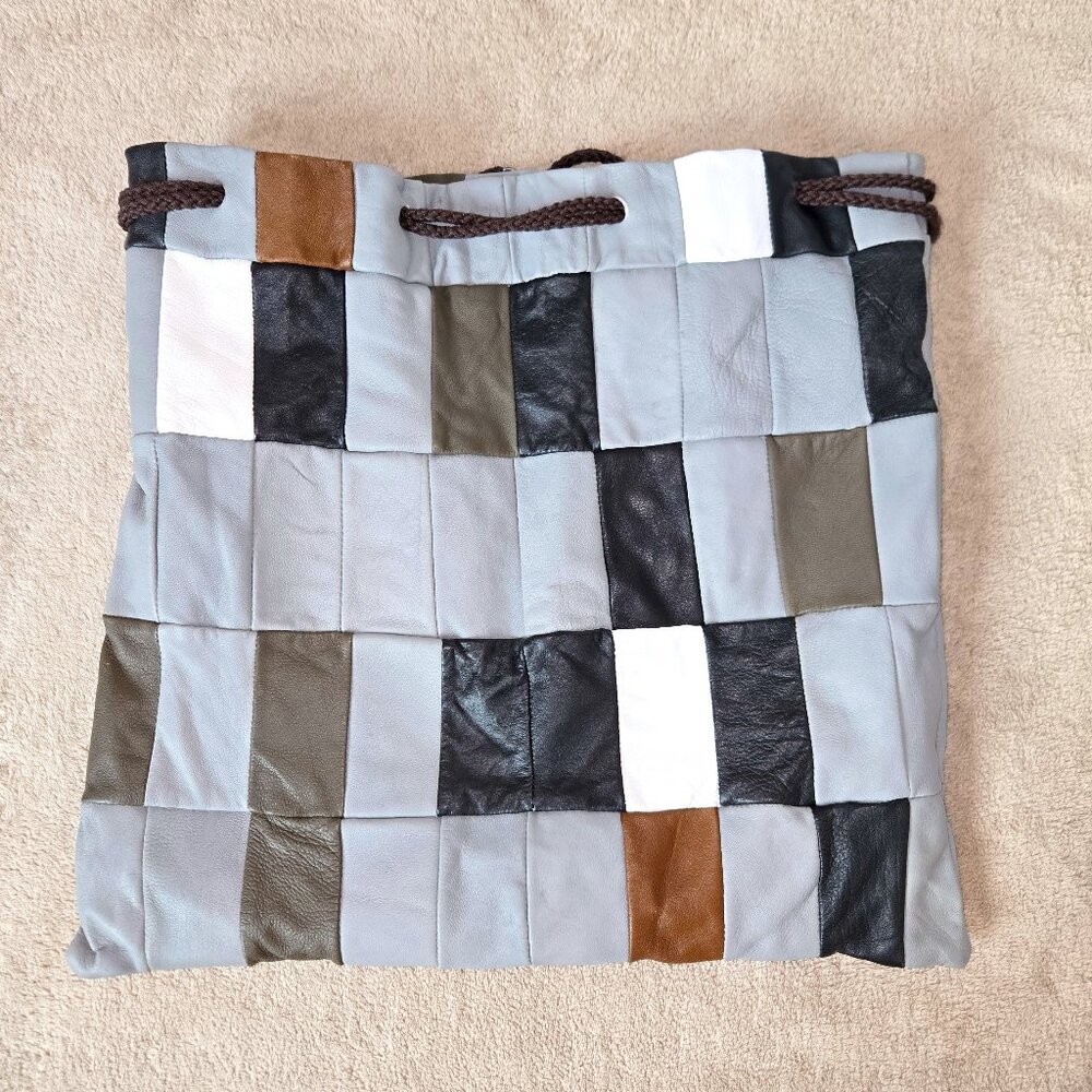 Vintage artisanal patchwork leather drawstring bag, made in Italy